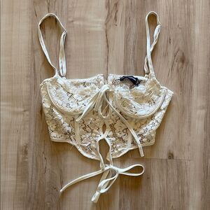PrettyLittleThing Lace Bustier crop top in Cream